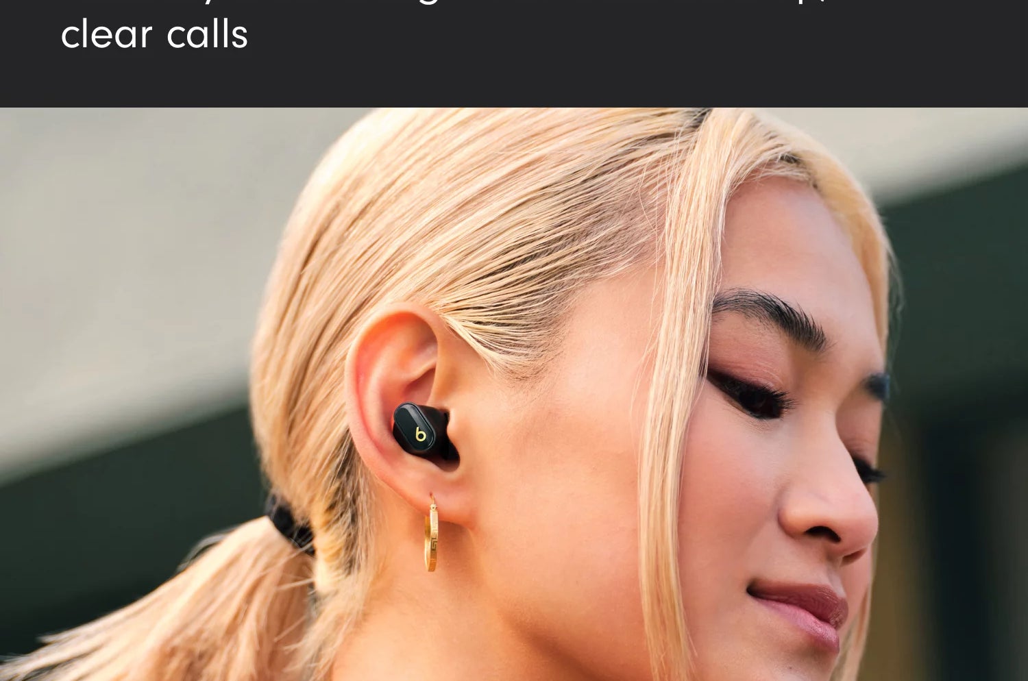 a model wearing the earbuds in black