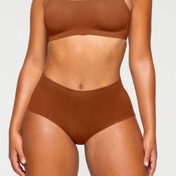 Another model in a lighter brown set