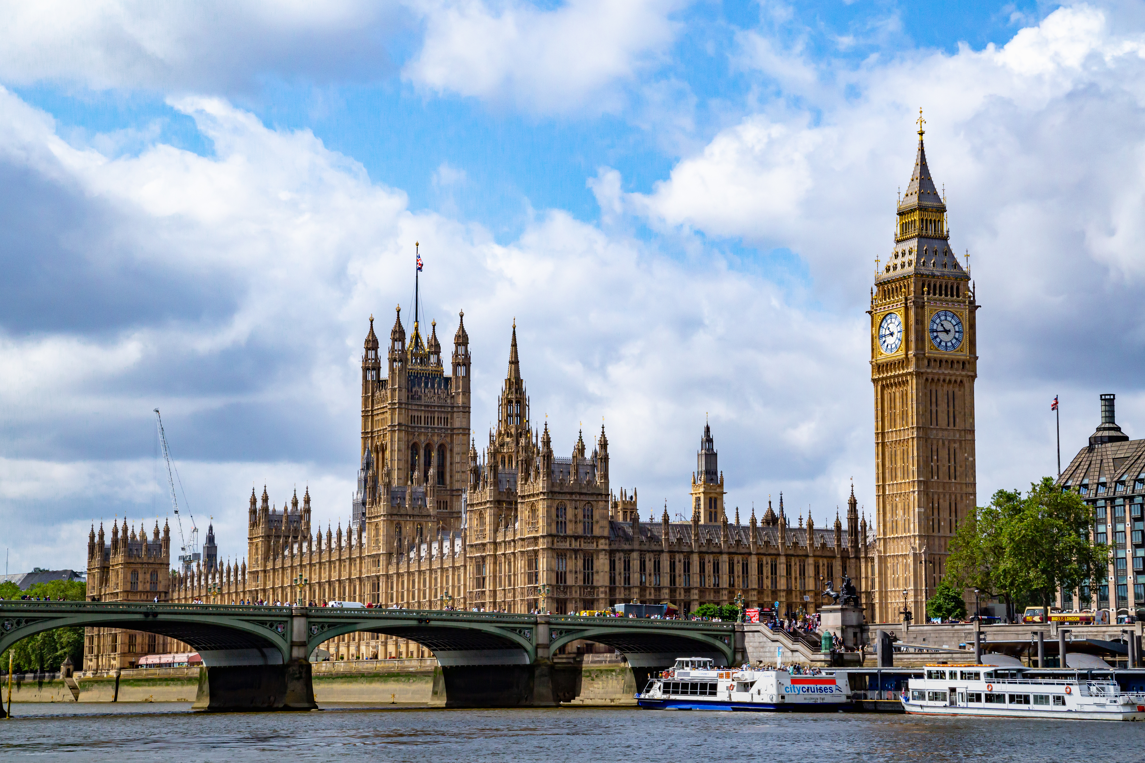a view from the River Thames in London of the palace of westminster and big ben