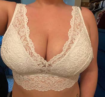 reviewer wearing longline V-neck lace bralette in white
