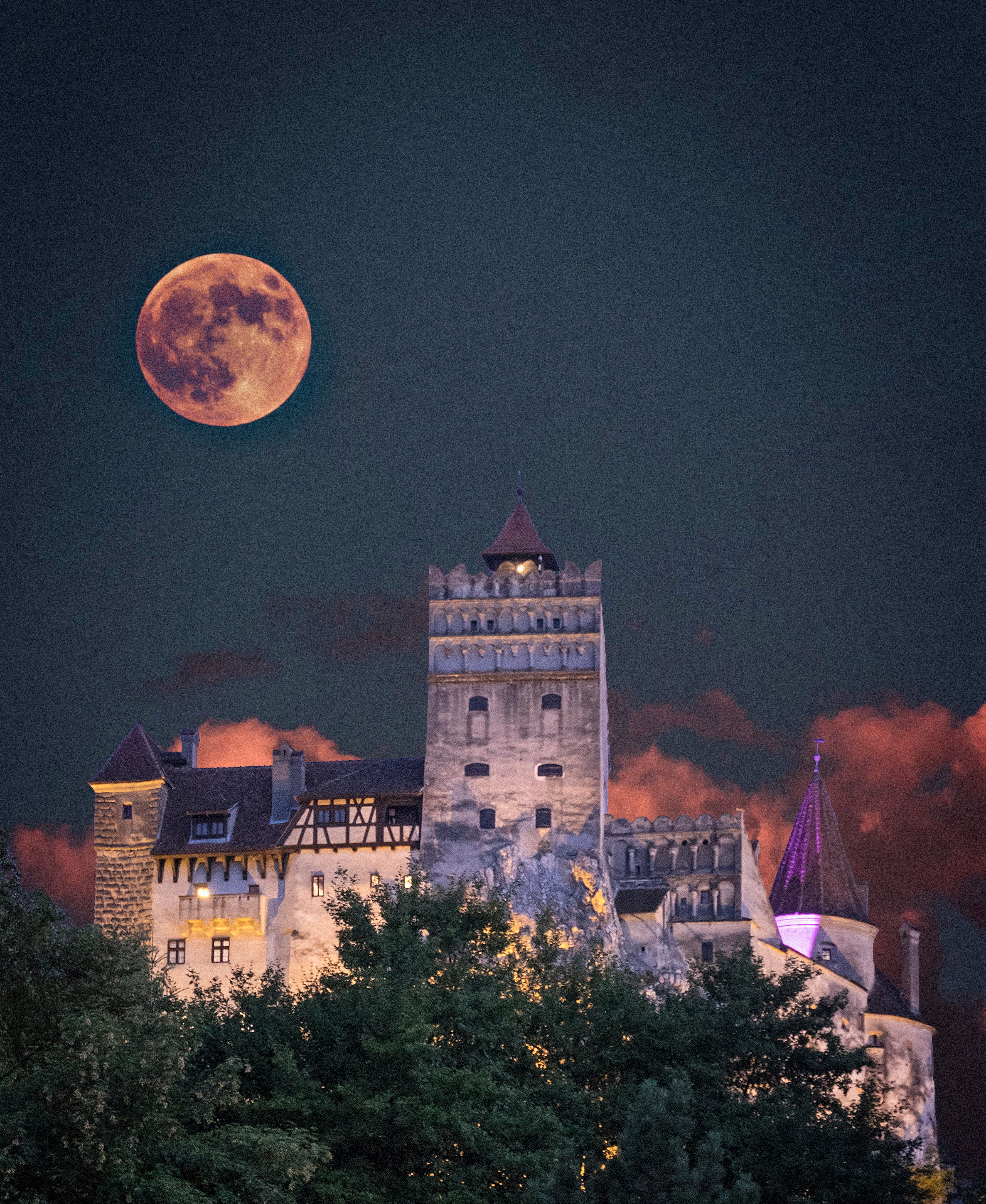 blood moon above a castle