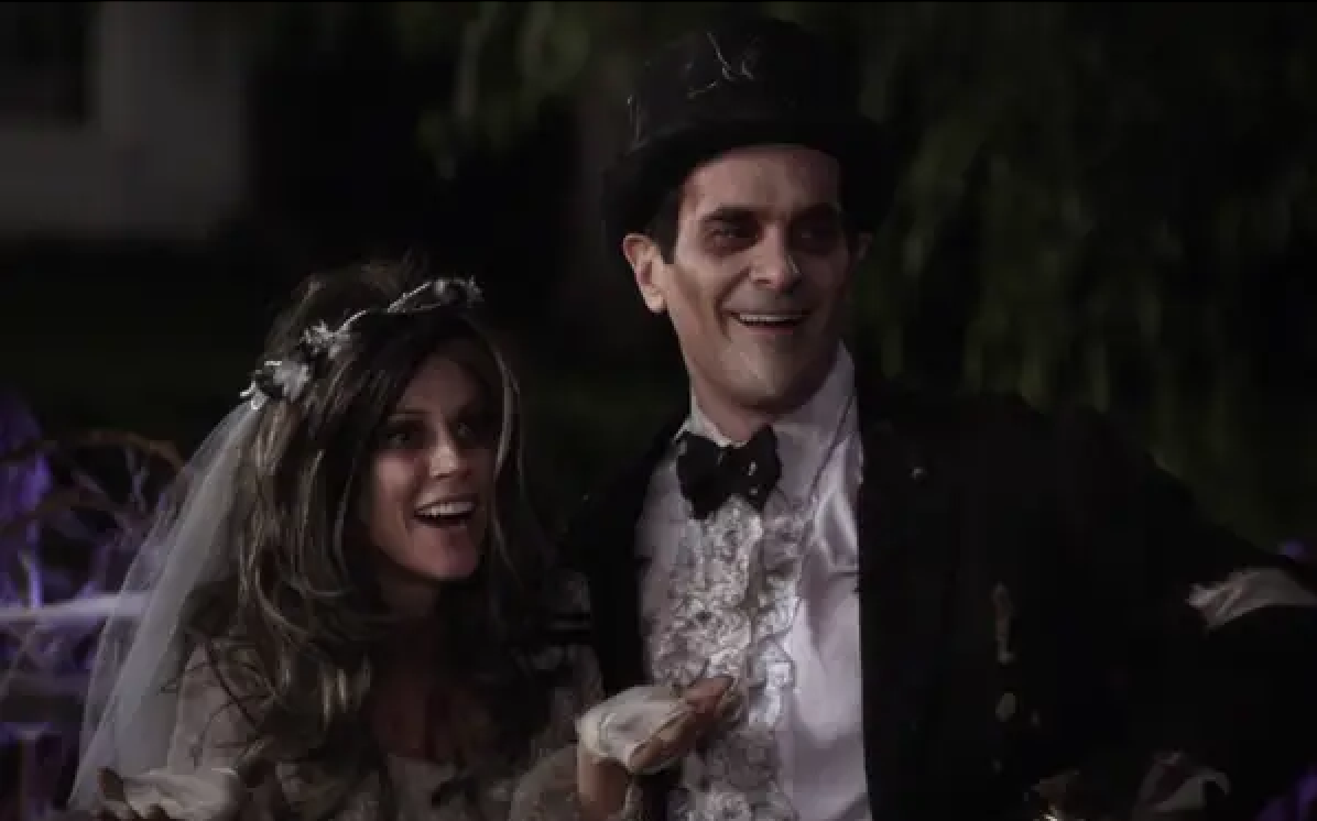 Claire and Phil in zombie wedding attire.