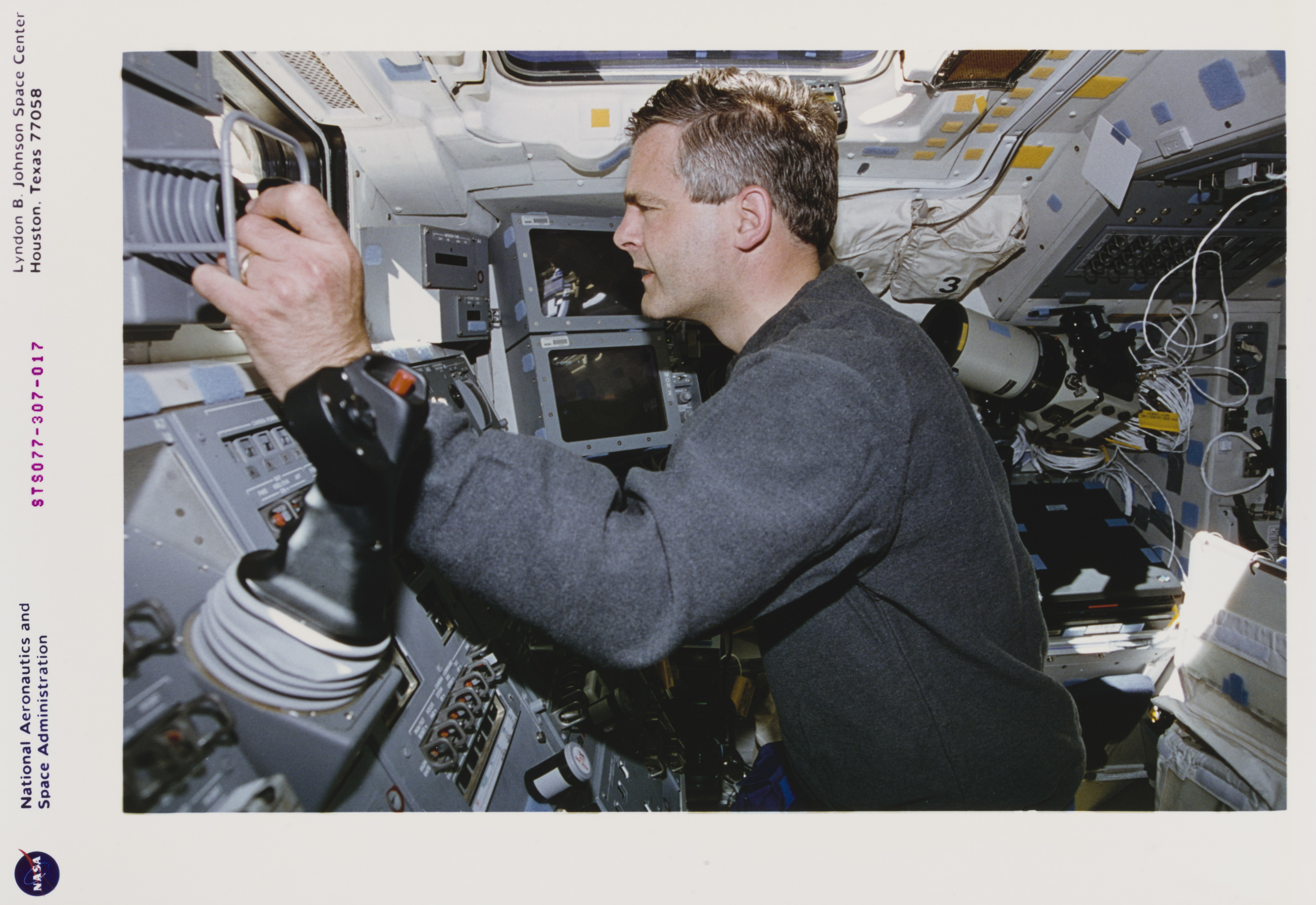Marc Garneau inside a space shuttle.