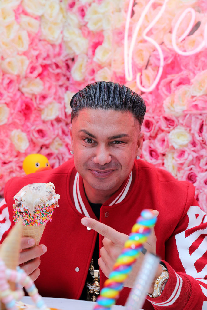 With spiked hair and holding an ice cream cone