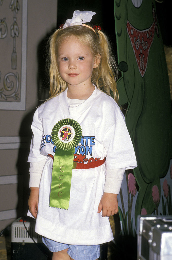 A child in an oversize T-shirt