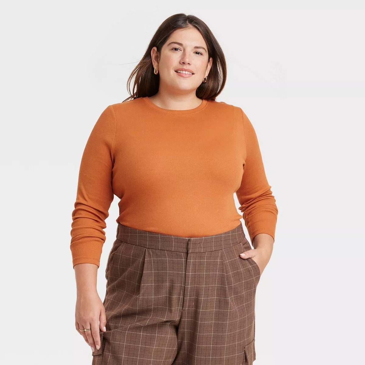 orange crewneck sweater on model