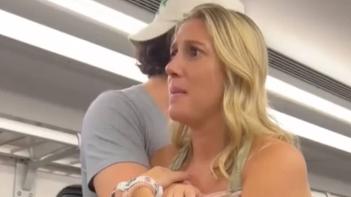 The 30-year-old New Jersey woman approached a group of male tourists on a train and told them to "get the f**k out of our country."