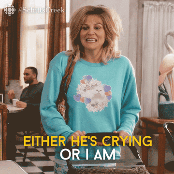 A woman rocking a baby carriage and saying, &quot;either he's crying or I am&quot;