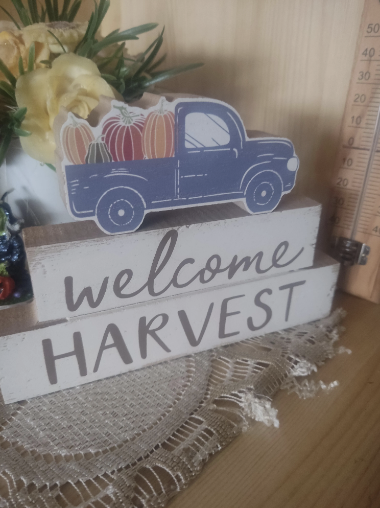 a plaque that says, &quot;welcome harvest&quot;