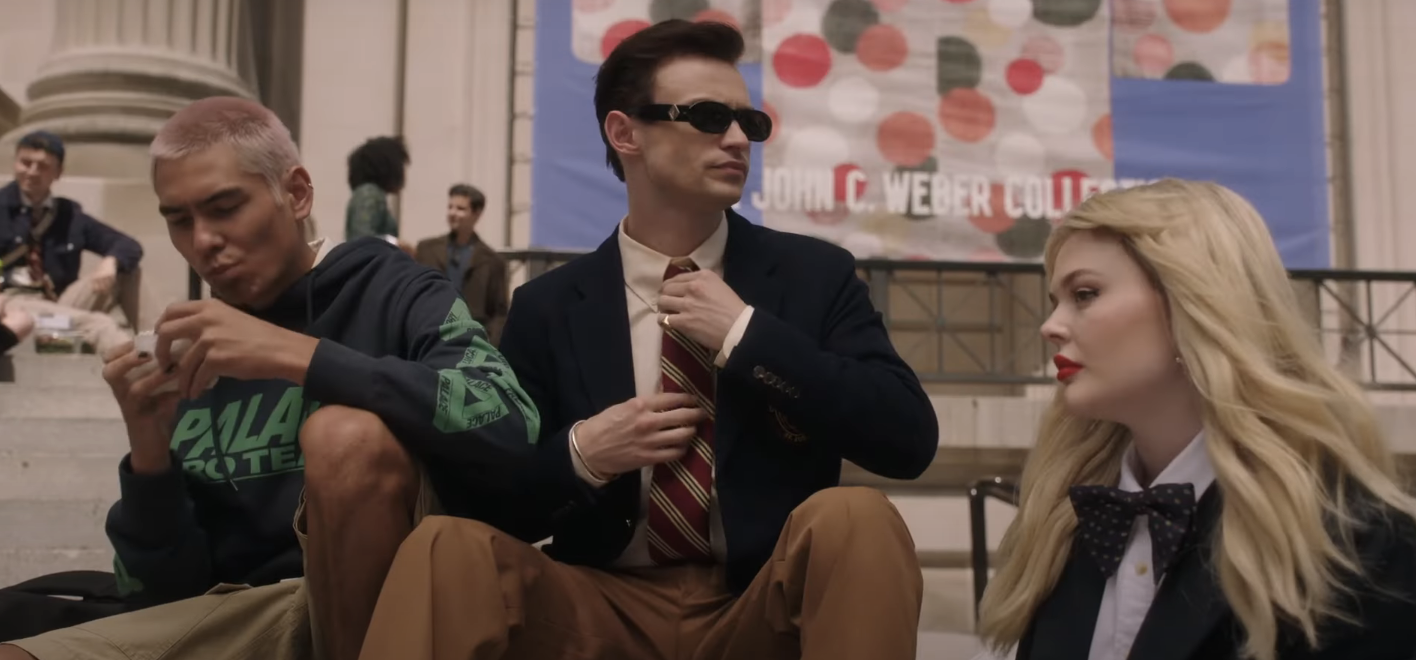 teens sitting outside the school building