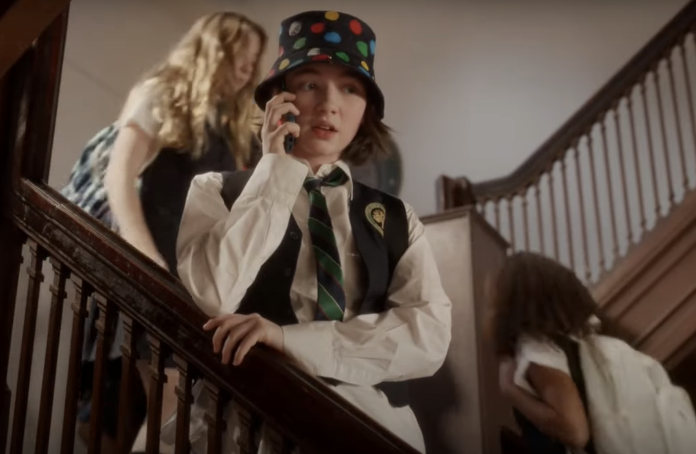 teen on the phone in the hallway