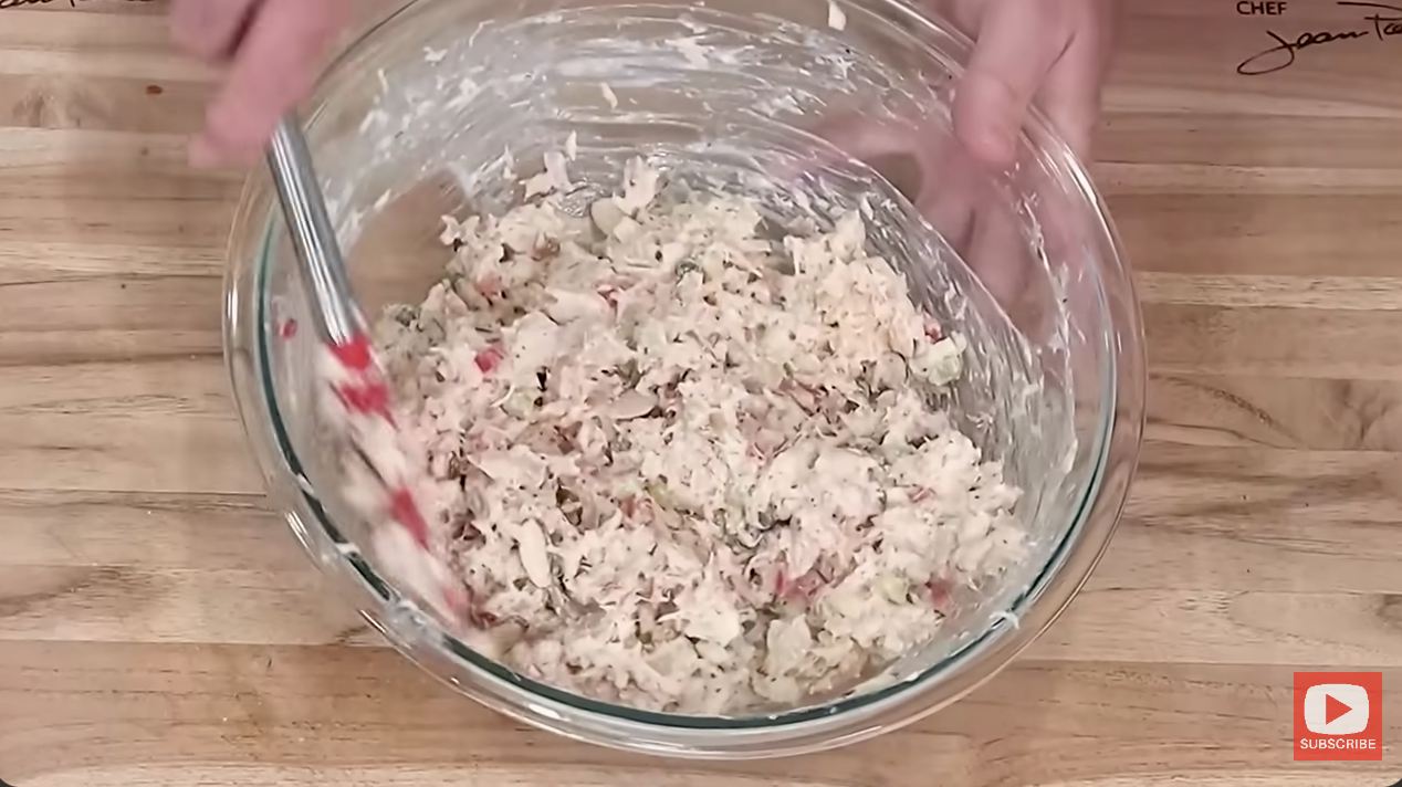 mixing a bowl of tuna salad