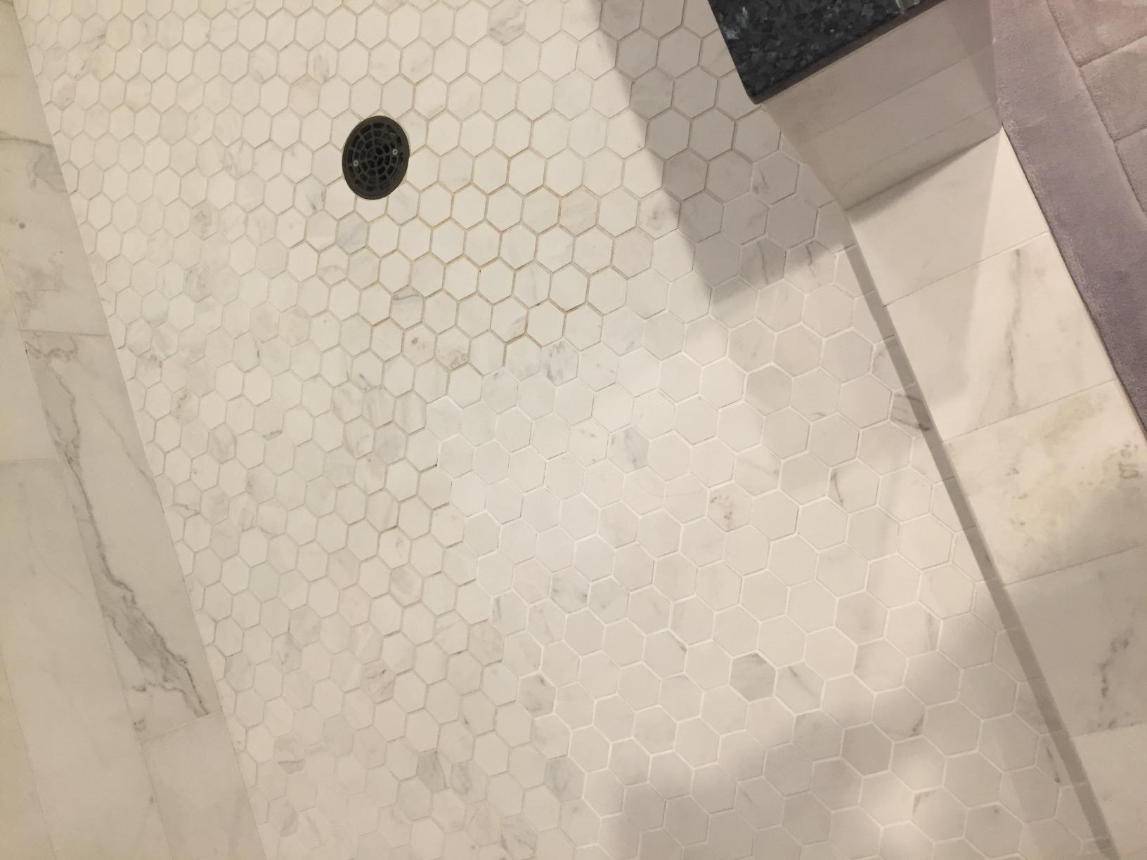 a reviewer photo of a section of the grout cleaned with the pen