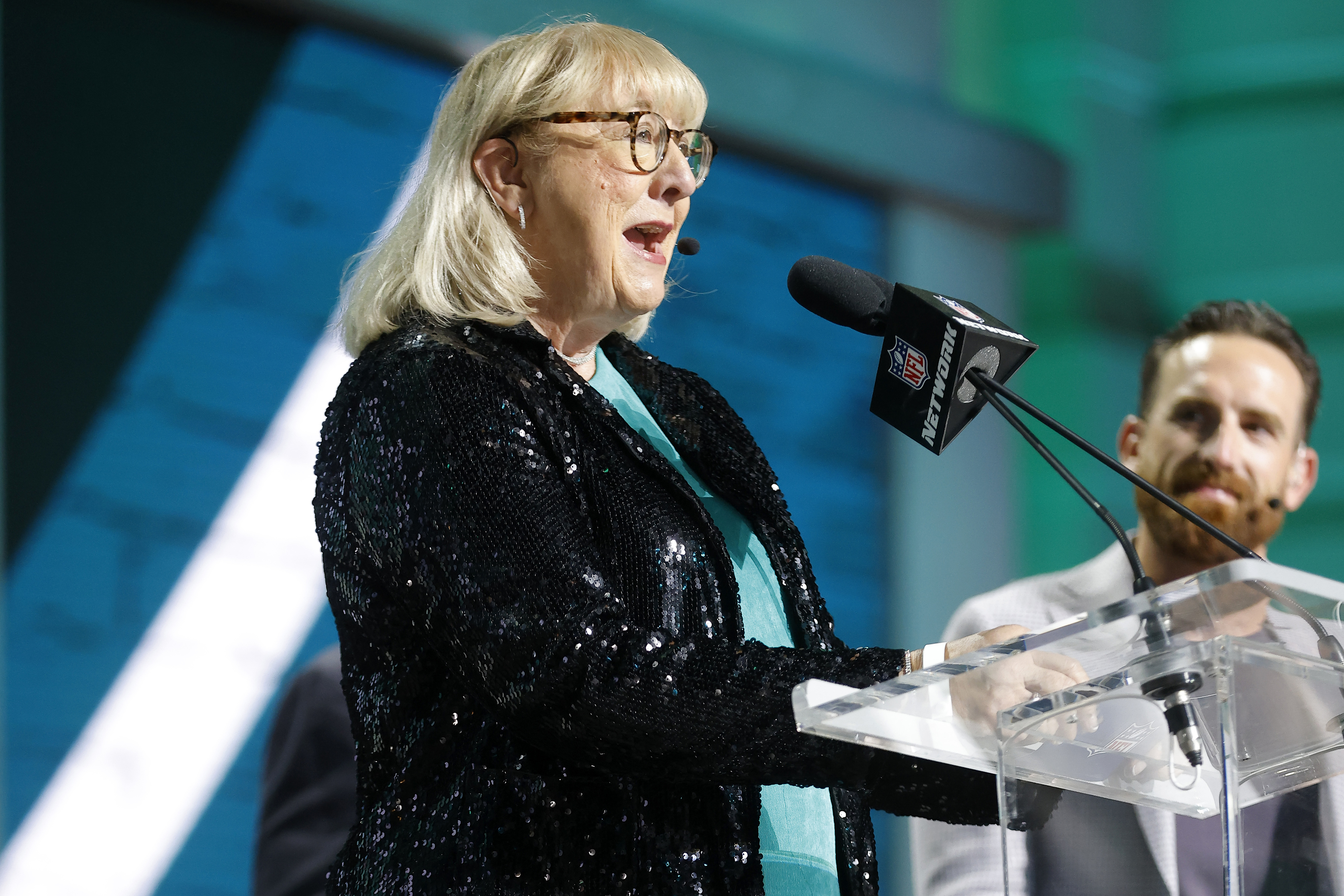 her speaking at a podium