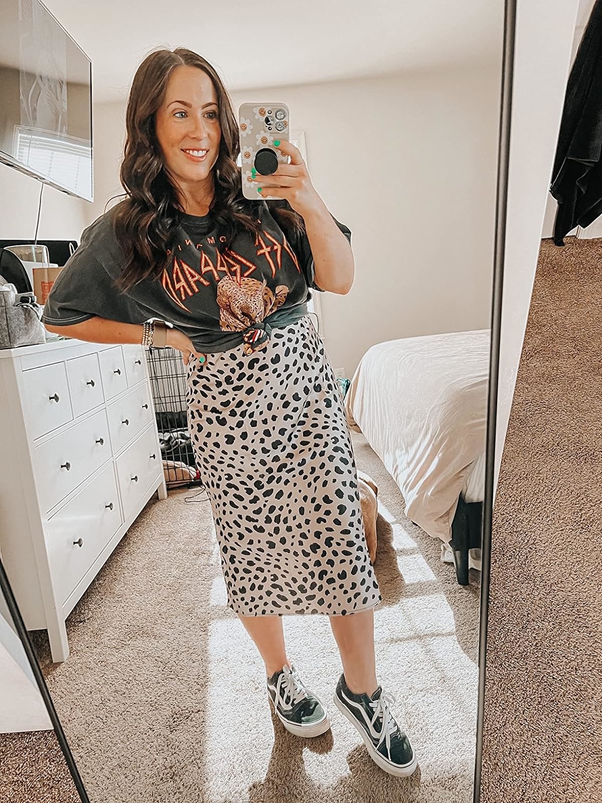 Reviewer wearing the patterned black and white skirt with a graphic tee and sneakers