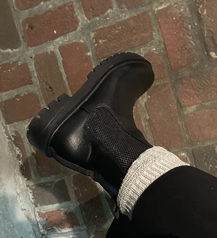 Reviewer wearing the black boots