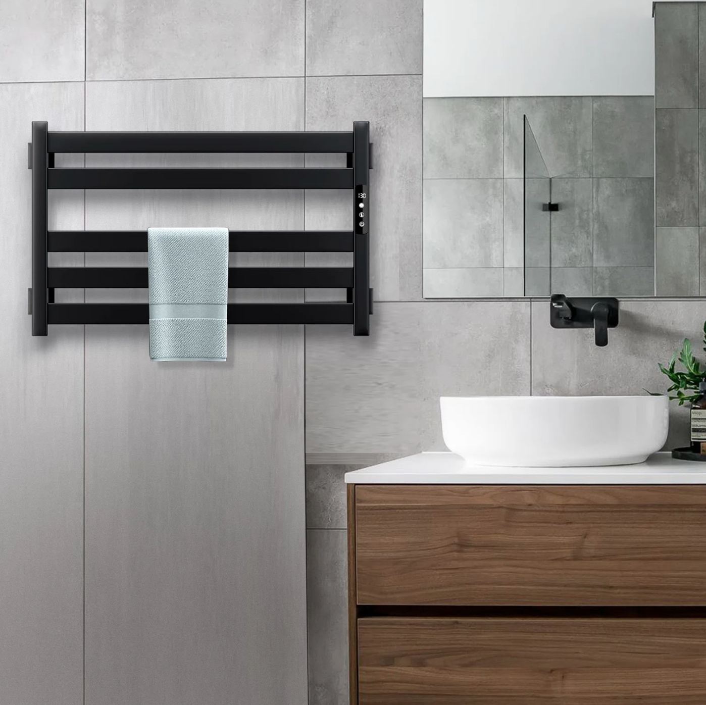 a black towel warmer hanging on the wall