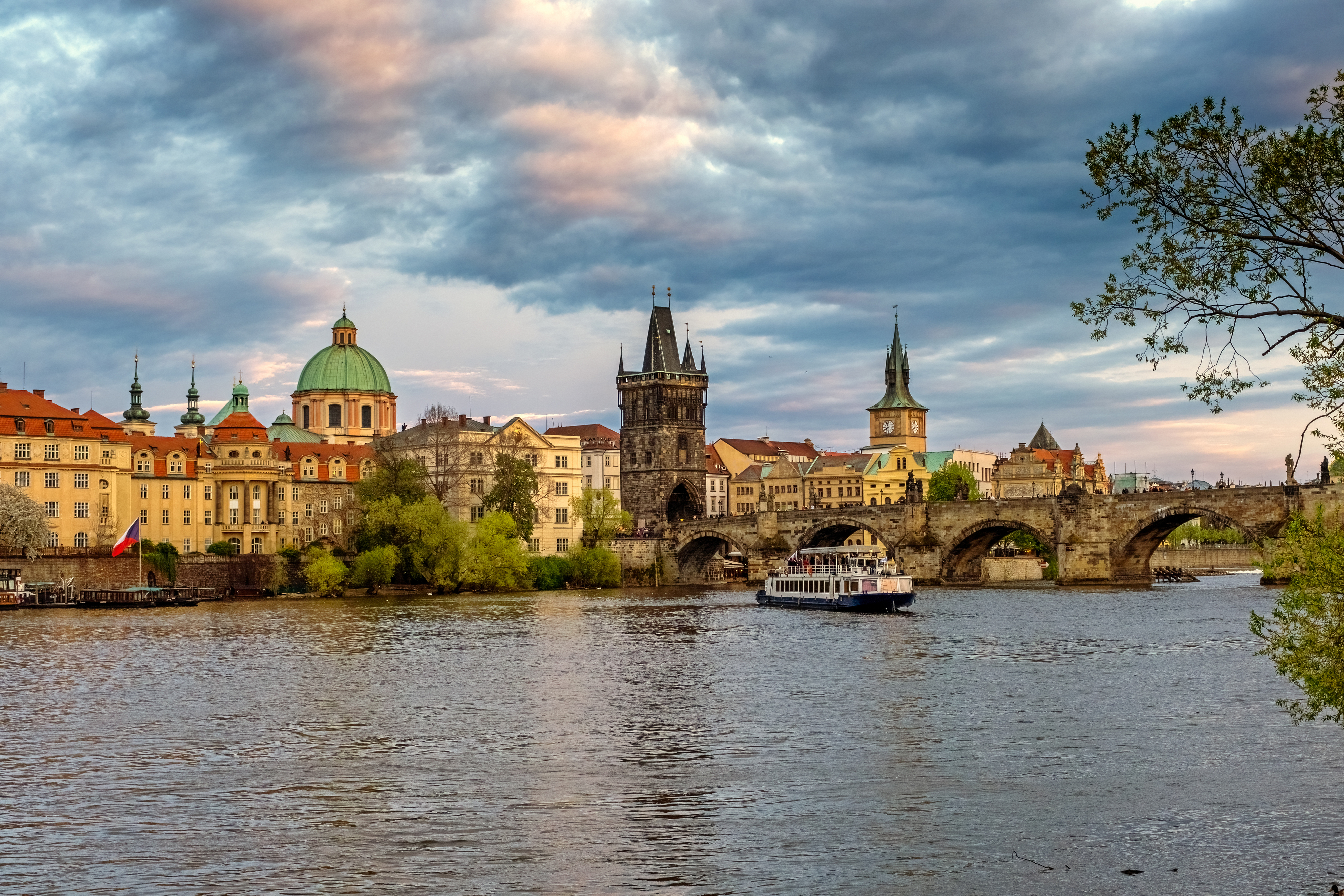 a view of the prague skyline and charles bridge
