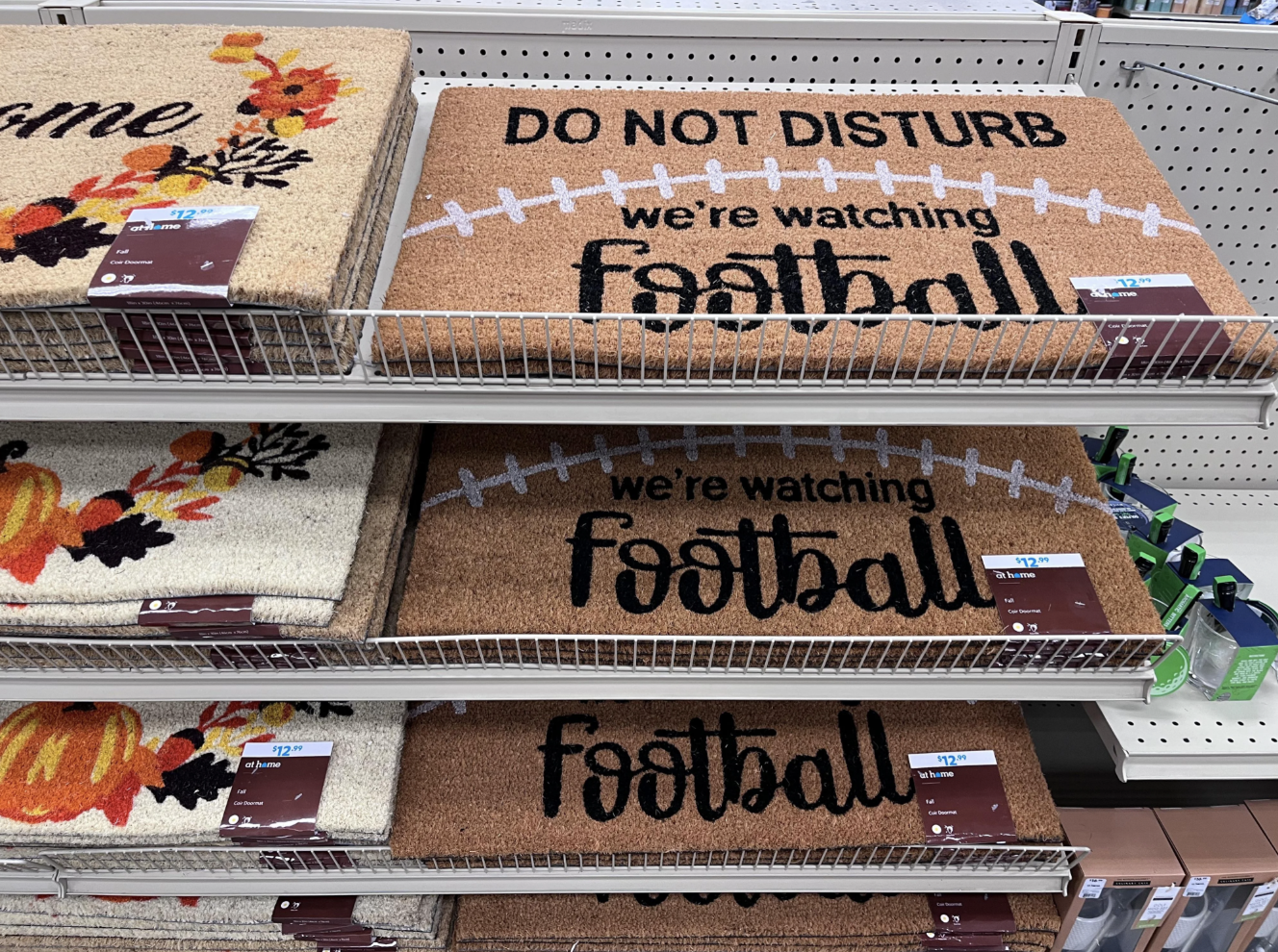 football mats on shelves in a store