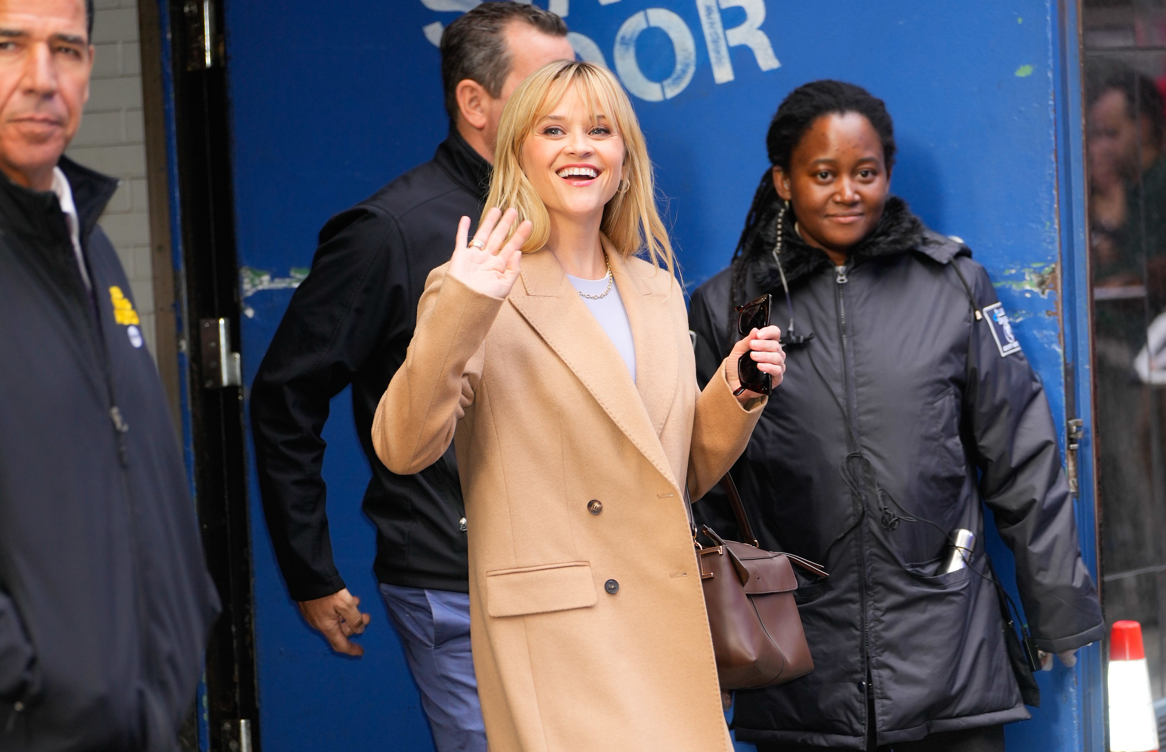 she&#x27;s waving at fans