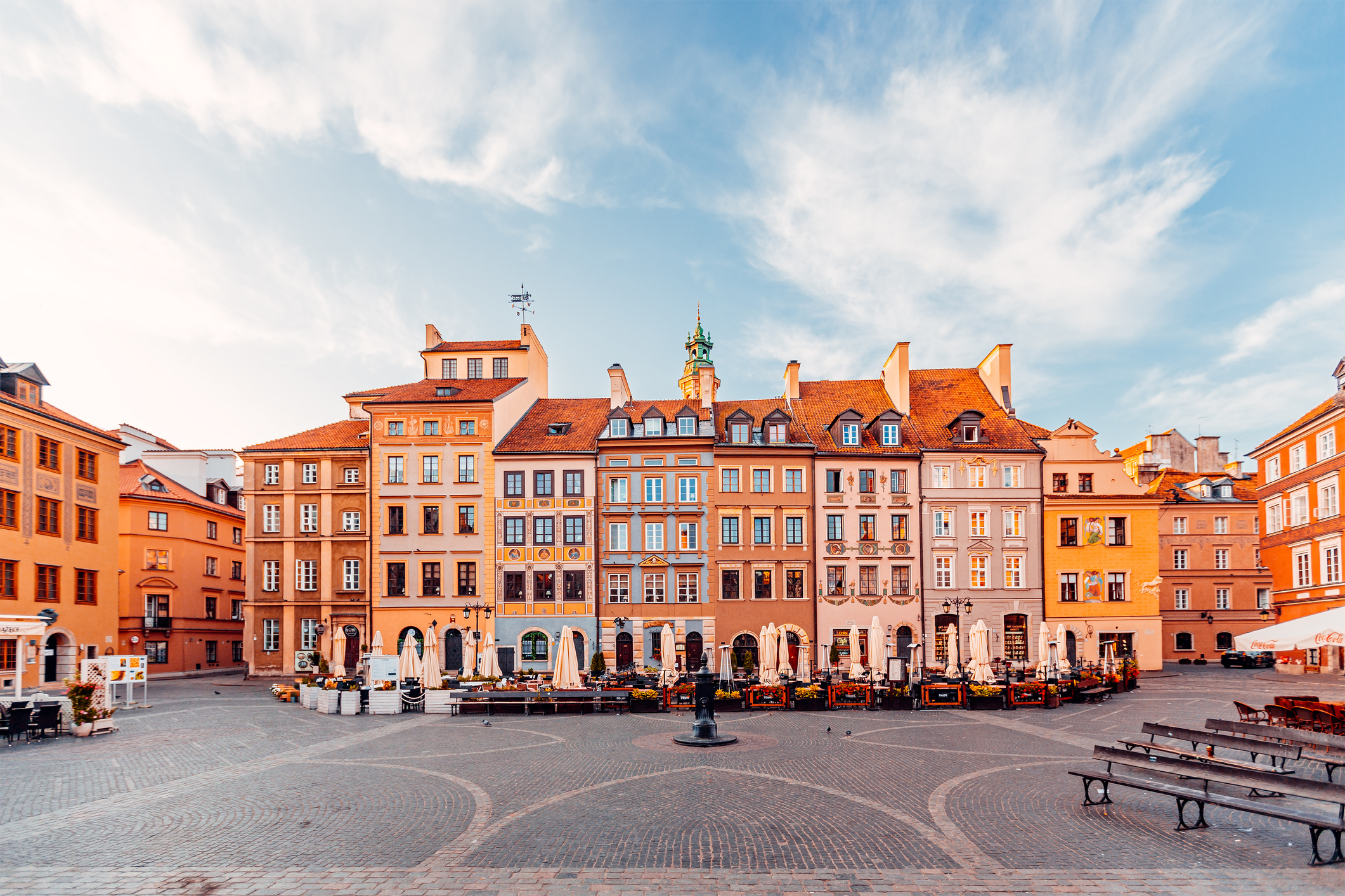 a row of colorful buildings in old town market square in warsaw, poland