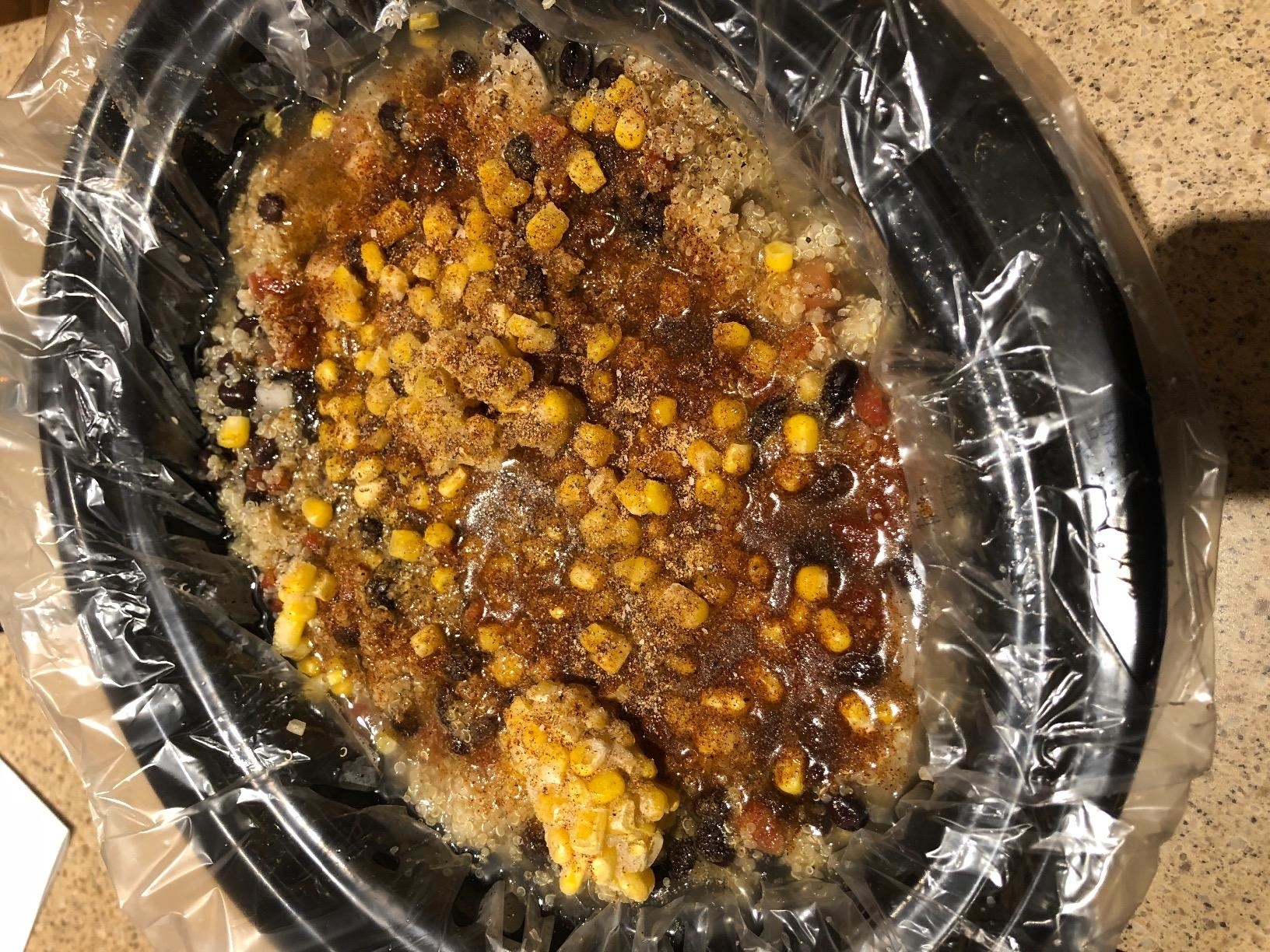 Reviewer image of the liner inside the crock pot filled with food
