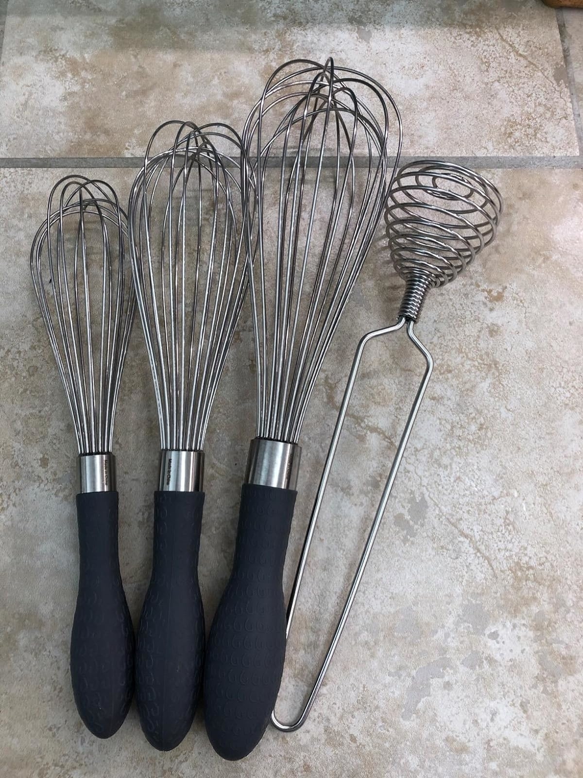 Reviewer image of the three whisks and a metal whisk