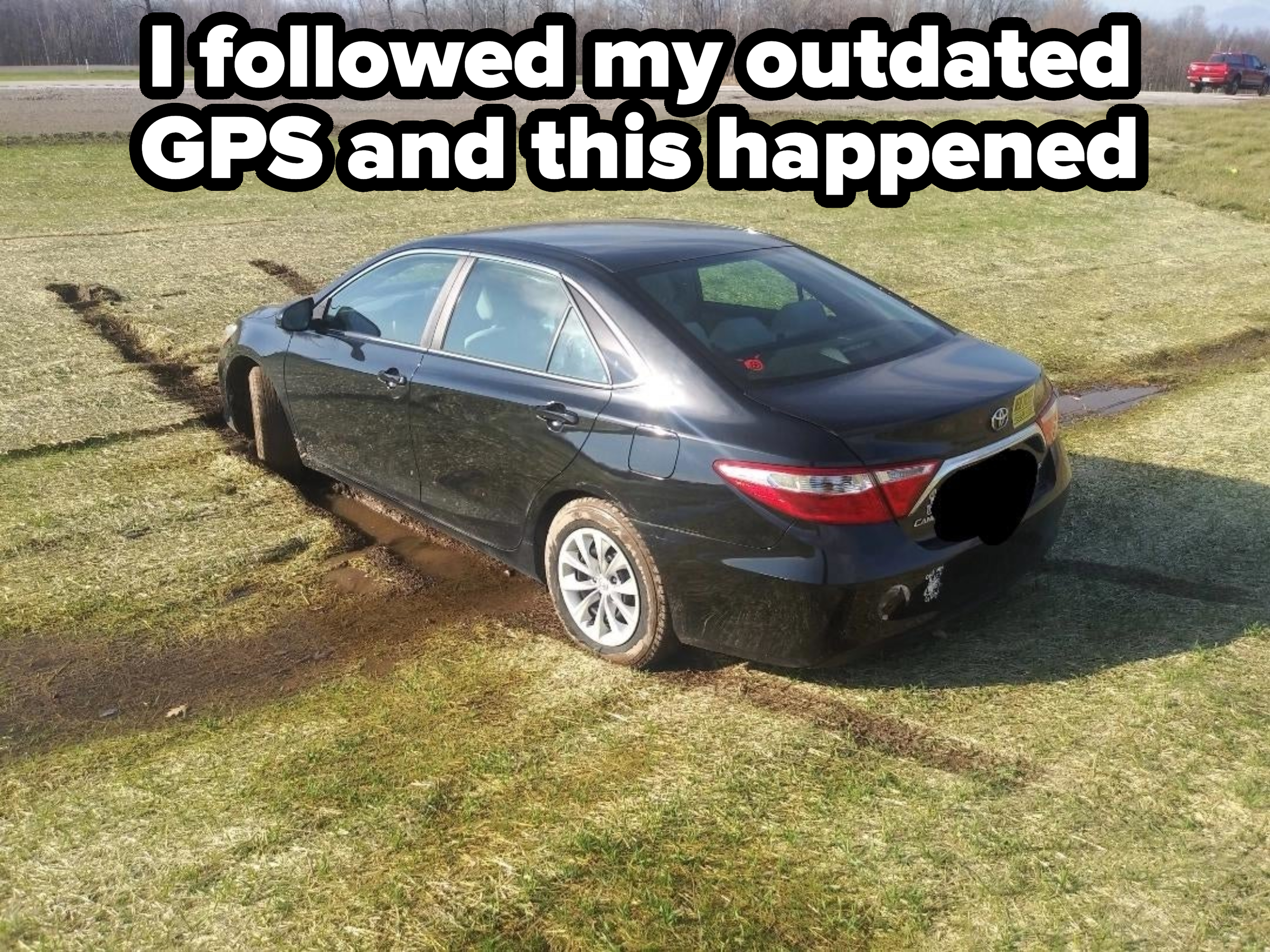 A car stuck in the grass, with caption, &quot;I followed my outdated GPS and this happened&quot;