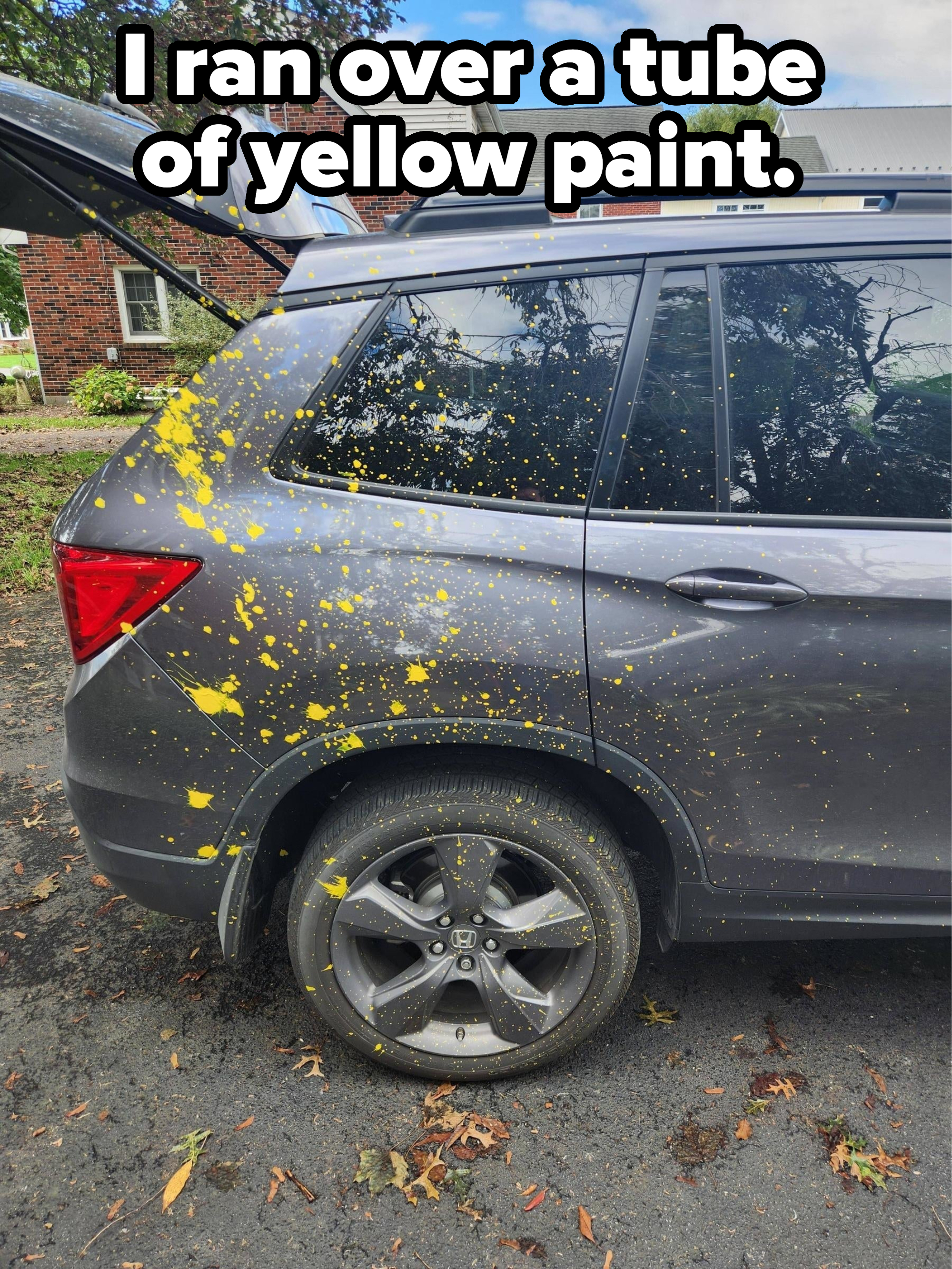 Person ran over a tube of yellow paint, and it got all over the back of their car
