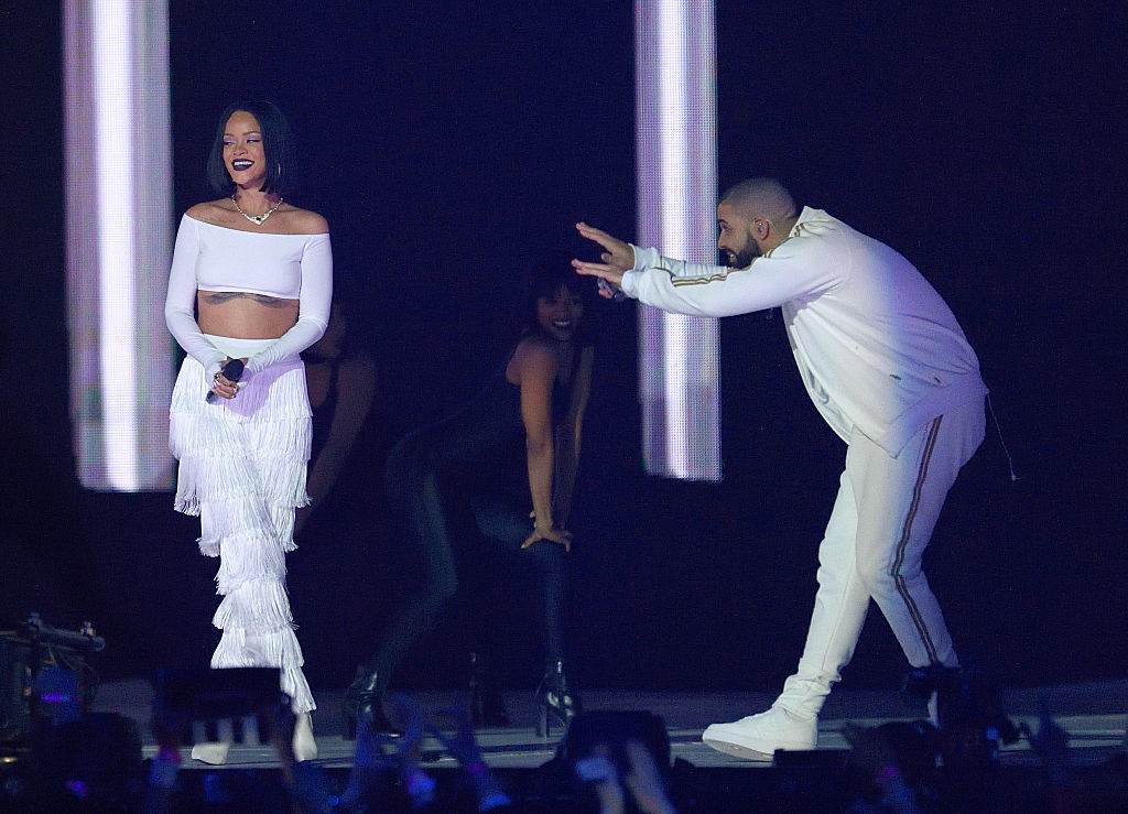drake bowing down to rihanna on stage