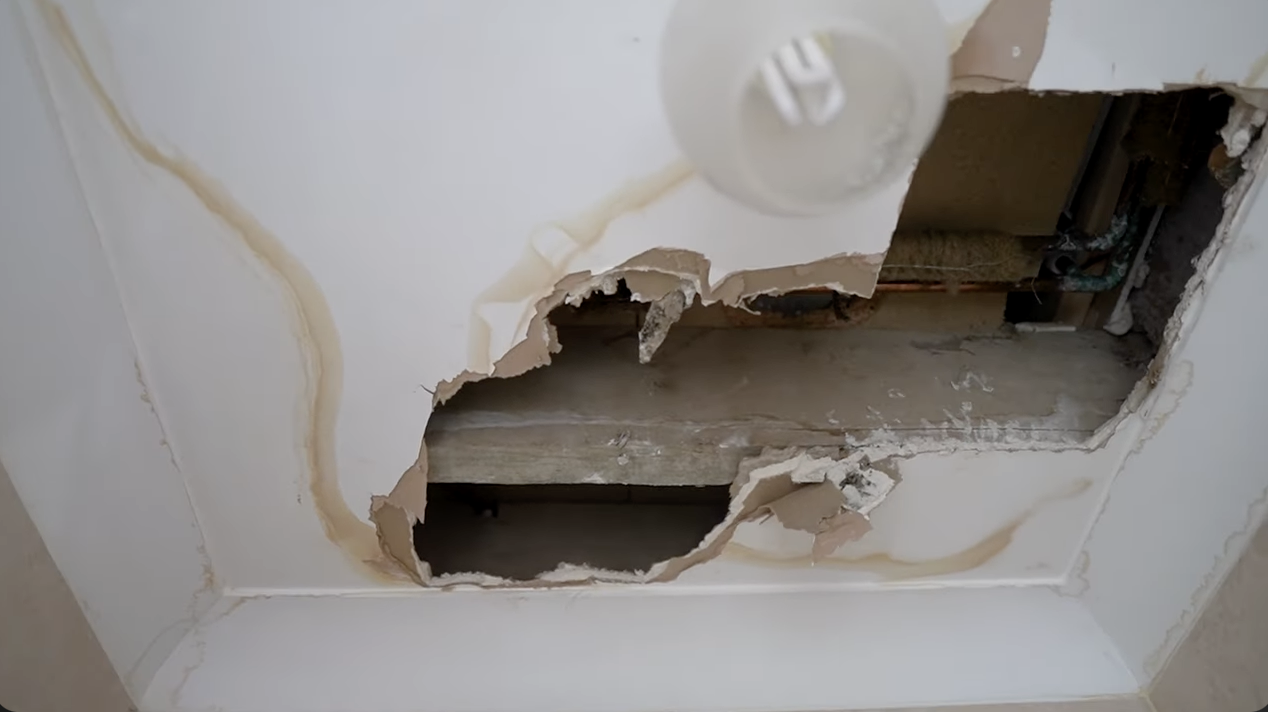 hole in a plaster ceiling caused by a leak