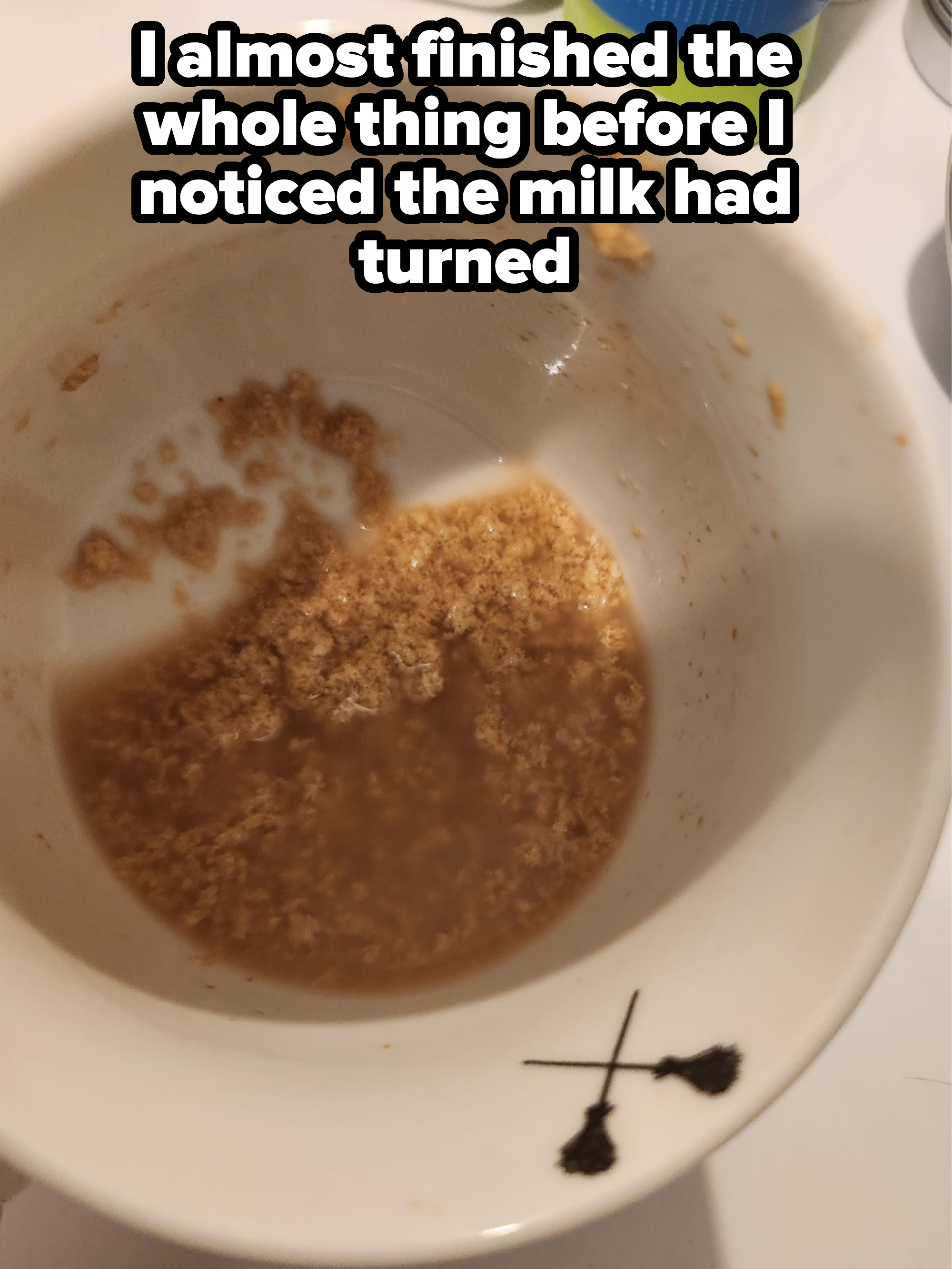 A cup with just a bit of liquid and clumps at the bottom, with caption, &quot;I almost finished the whole thing before I noticed the milk had turned&quot;