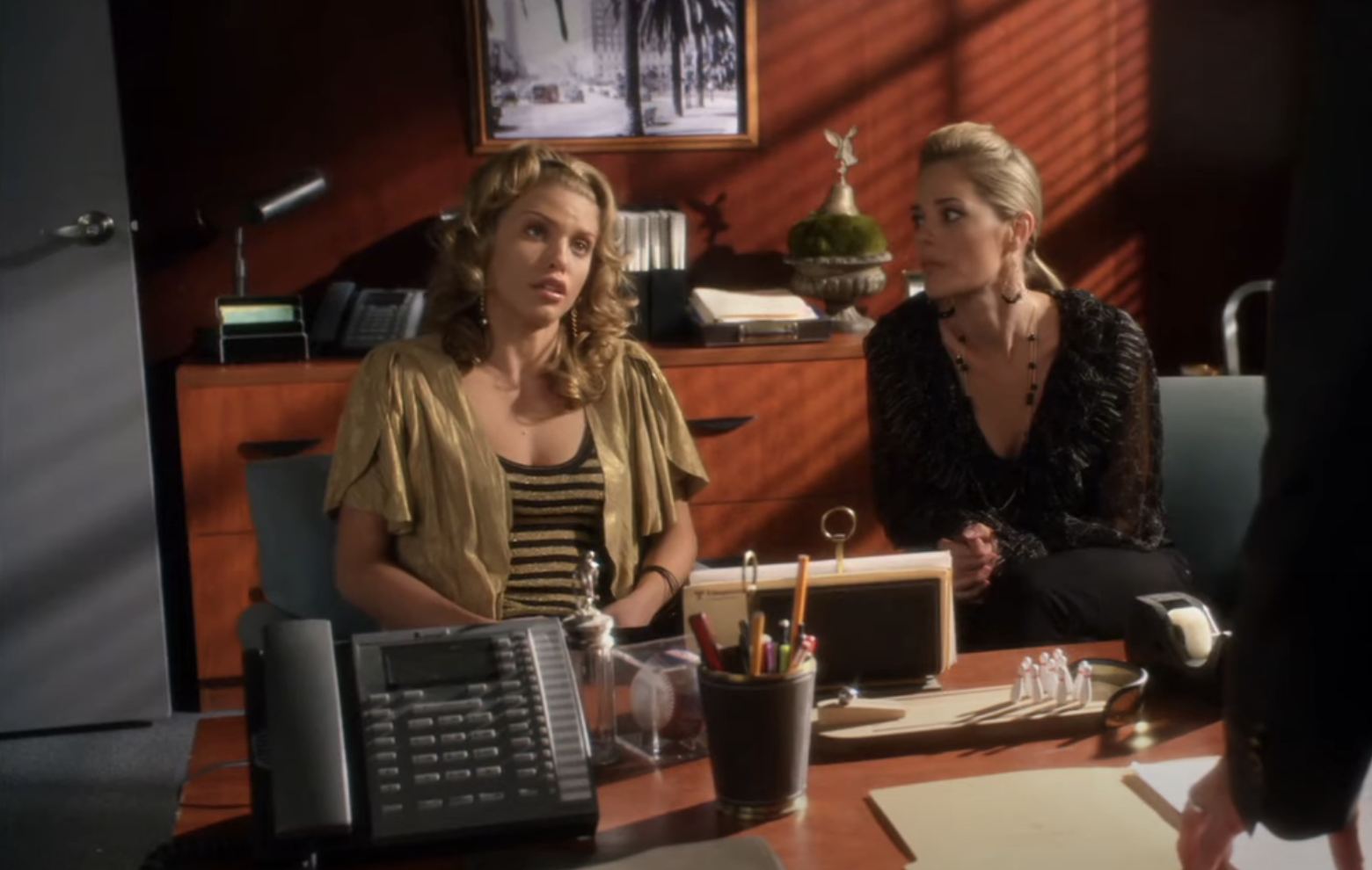 student with her mom in the principals office