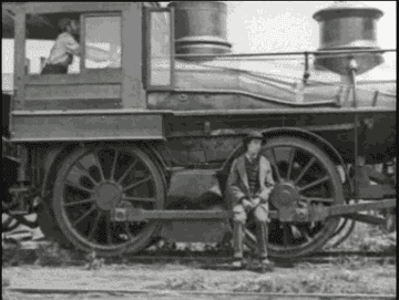 Person on train sits on the wheel conveyer.