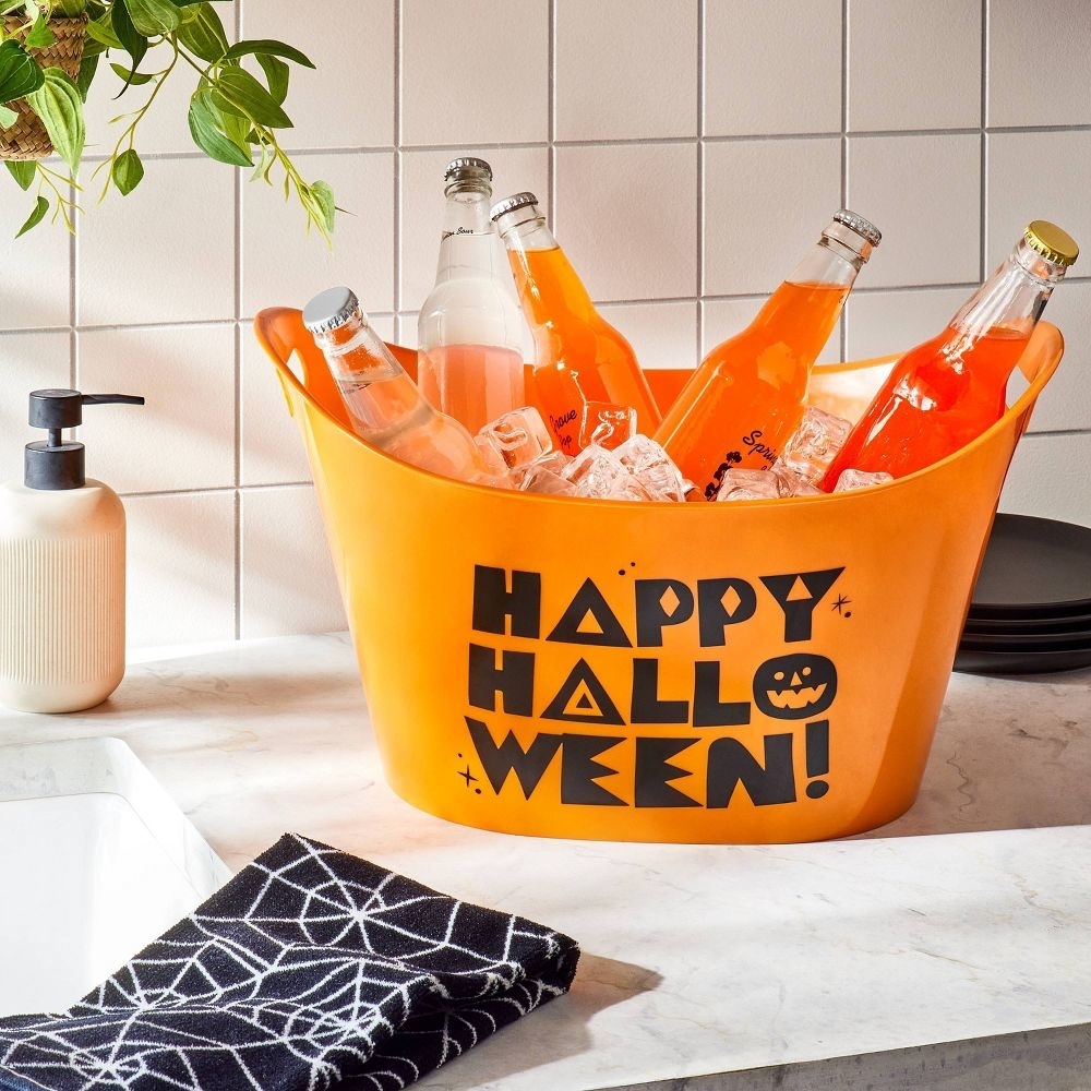 an orange tub that reads happy halloween