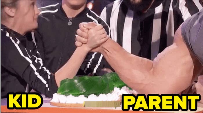 A woman labeled &quot;kid&quot; and a man with a huge bicep, labeled &quot;parent,&quot; arm wrestling
