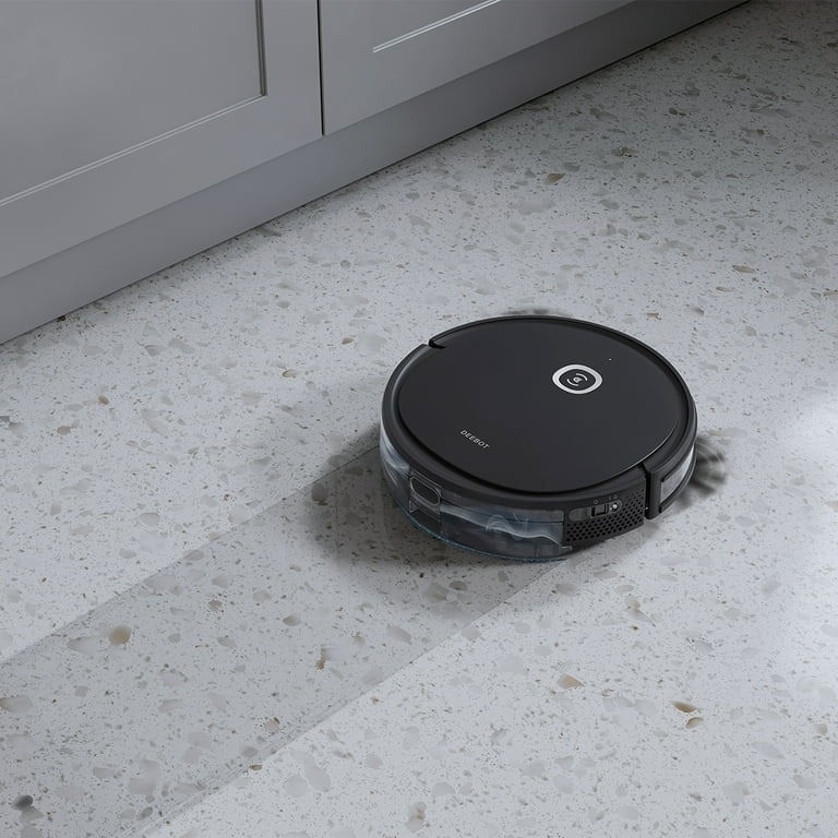 A robot vacuum mops the floor