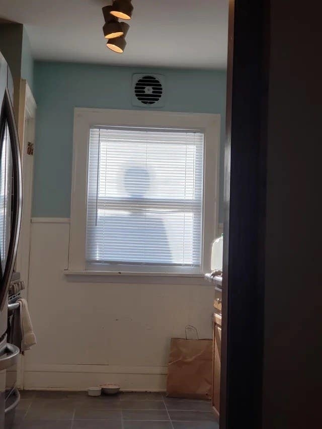 A silhouette in a door