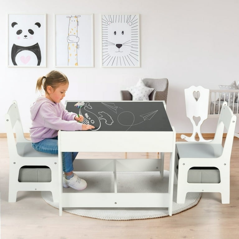 Toddler plays at a kid sized table