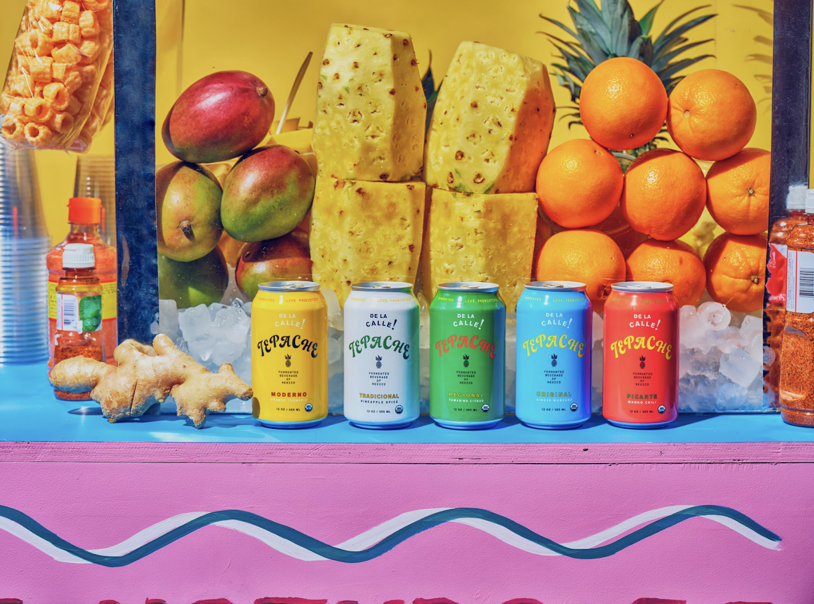 Various cans of De La Calle on colorful tabletop