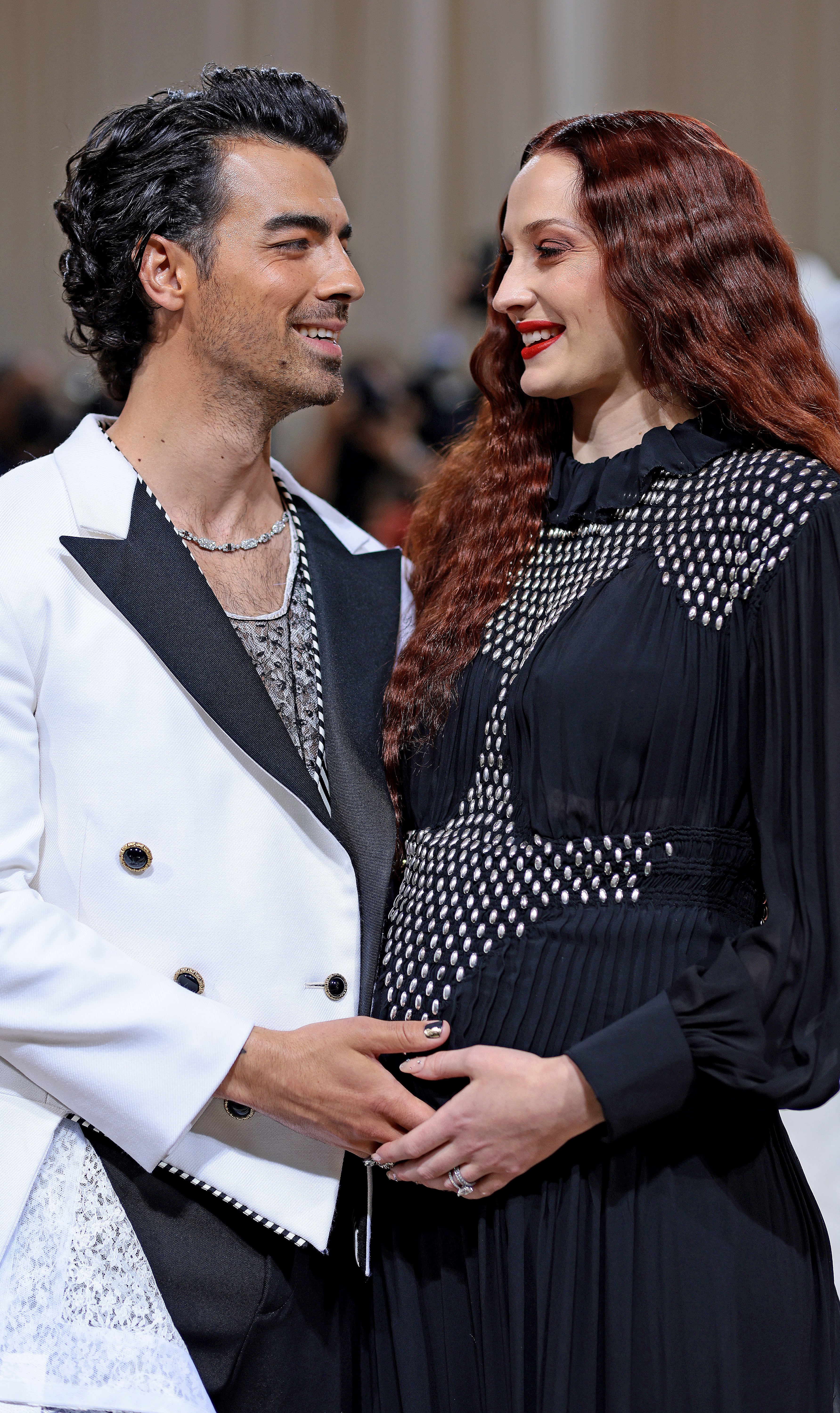 Close-up of Sophie and Joe smiling at each other at a media event