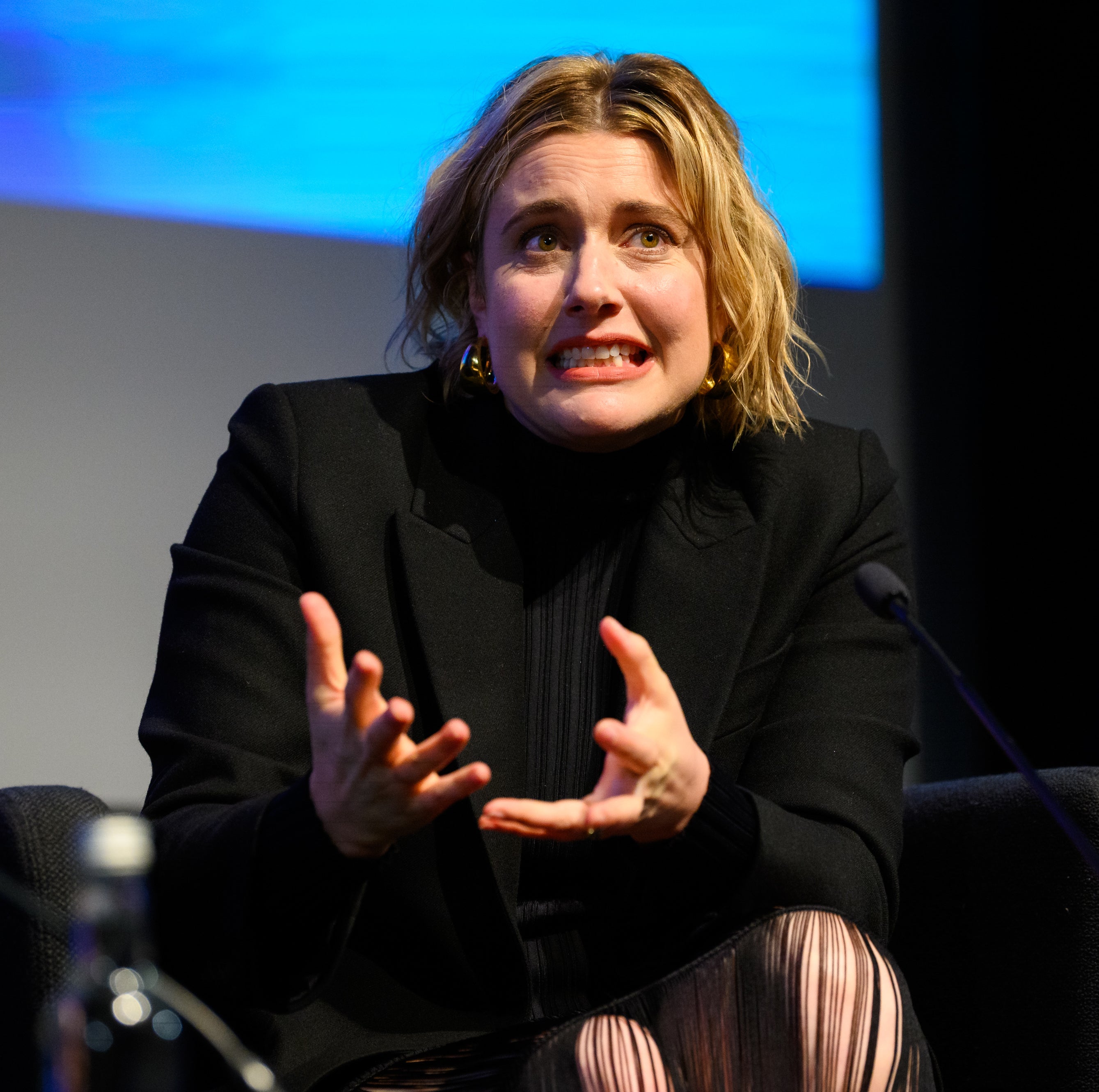 Closeup of Greta Gerwig talking onstage