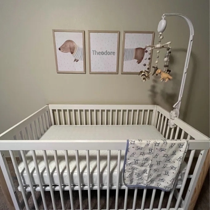 a reviewer photo of the mattress in a crib