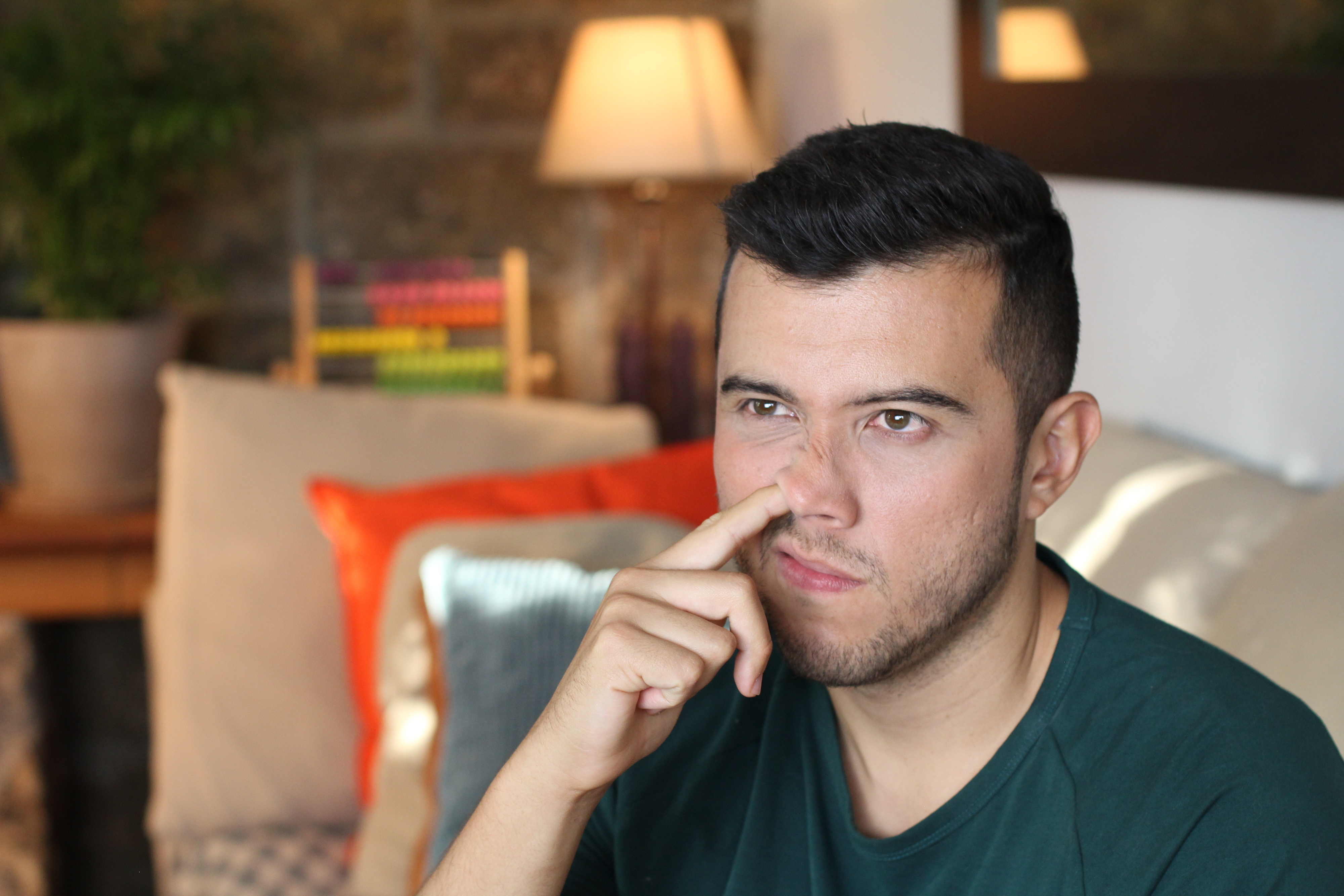 a man picking his nose