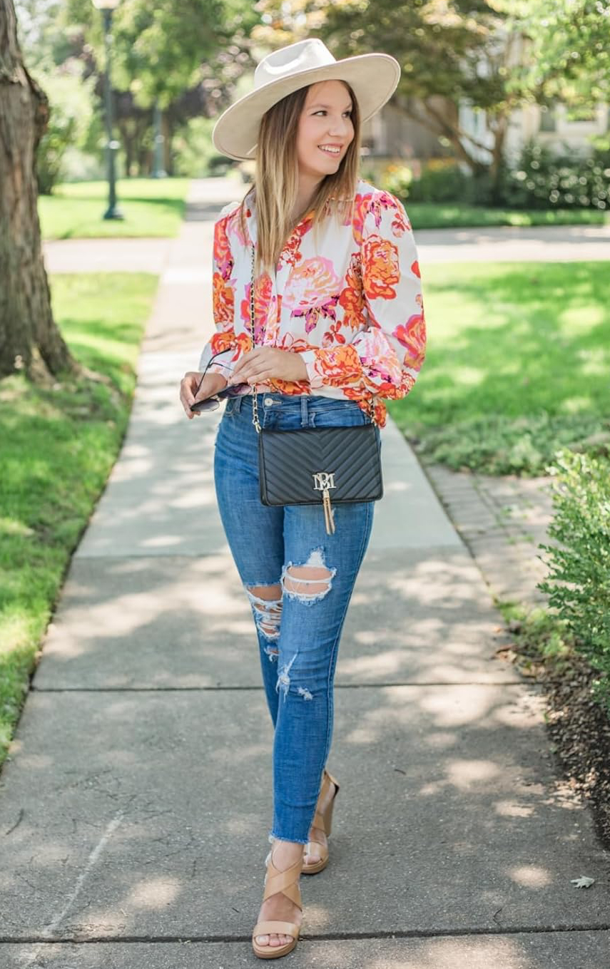 Reviewer wearing the red floral blouse