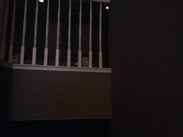 A Thomas the Tank Engine toy on a banister