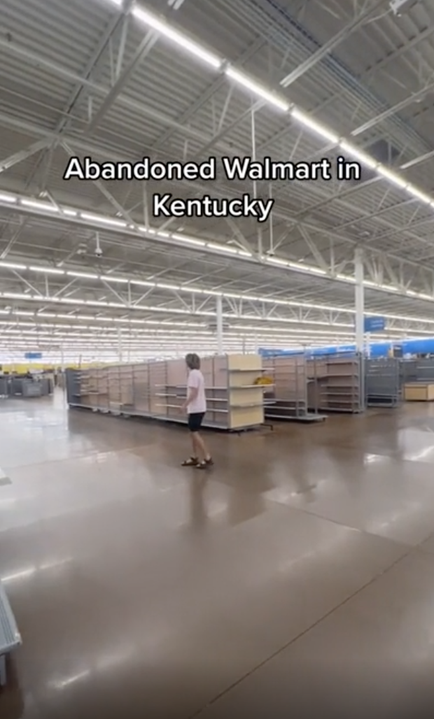 A person standing in an abandoned Walmart