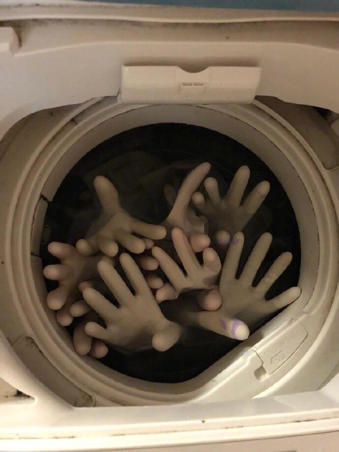 hands coming out of a washing machine