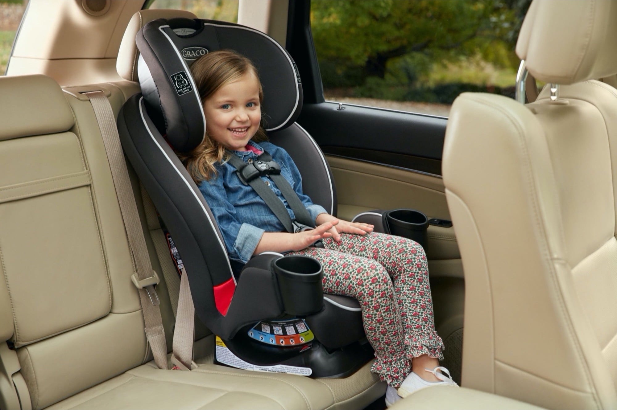 Child sits in a car seat