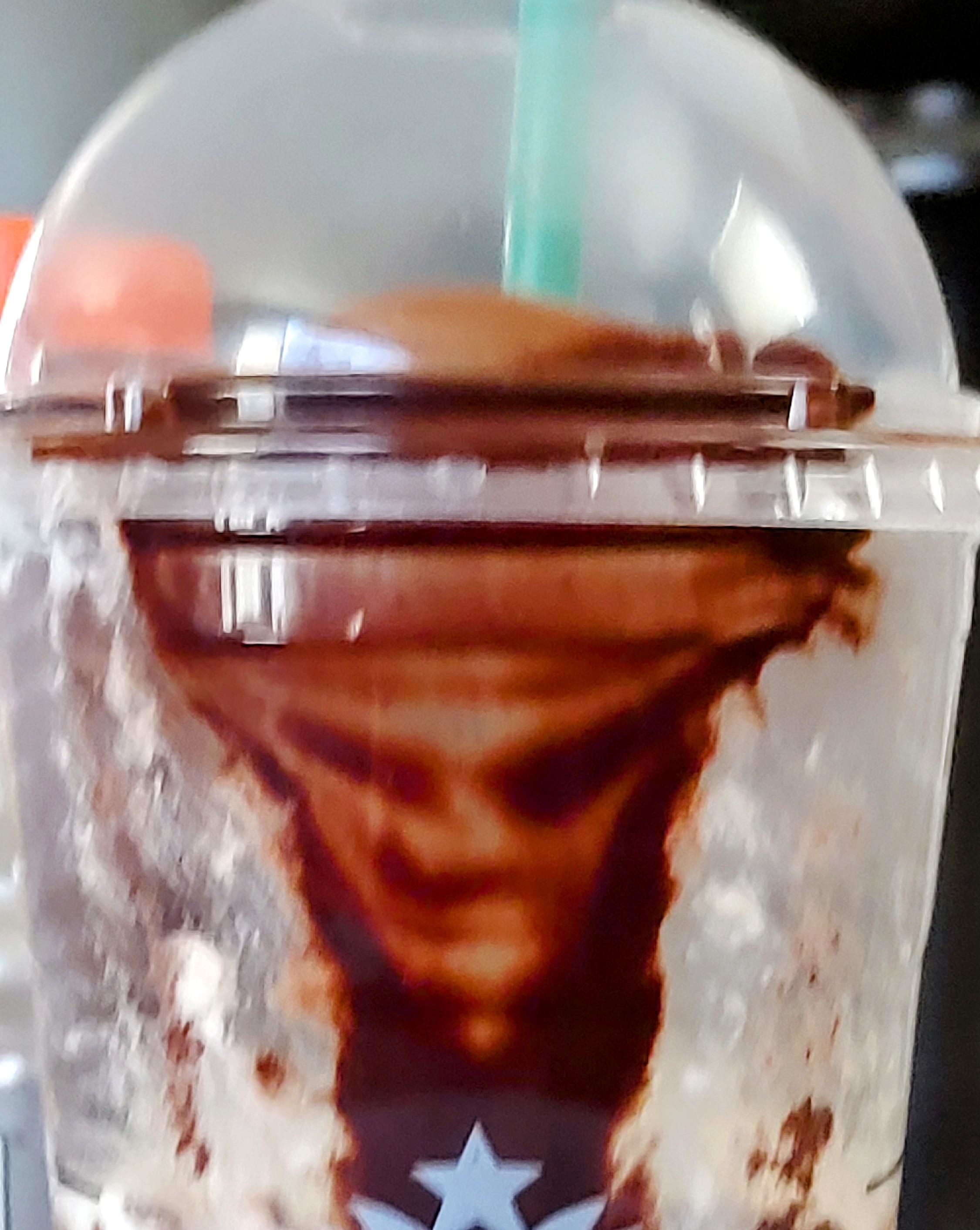 A face in someone&#x27;s drink